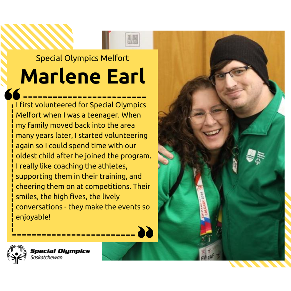 A photo of Marlene Earl smiling for the camera while hugging an athlete. They are both wearing green sweaters.