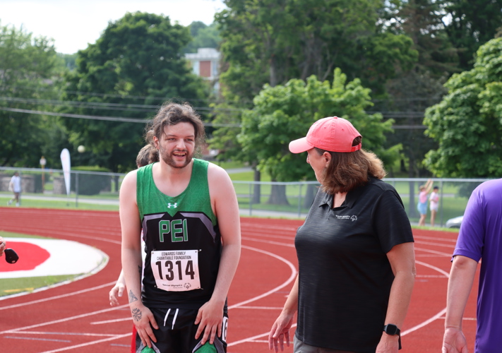 Male Athletes at SONS 2024 for Athletics, Special Olympics PEI, Athletics, Athlete with Coach