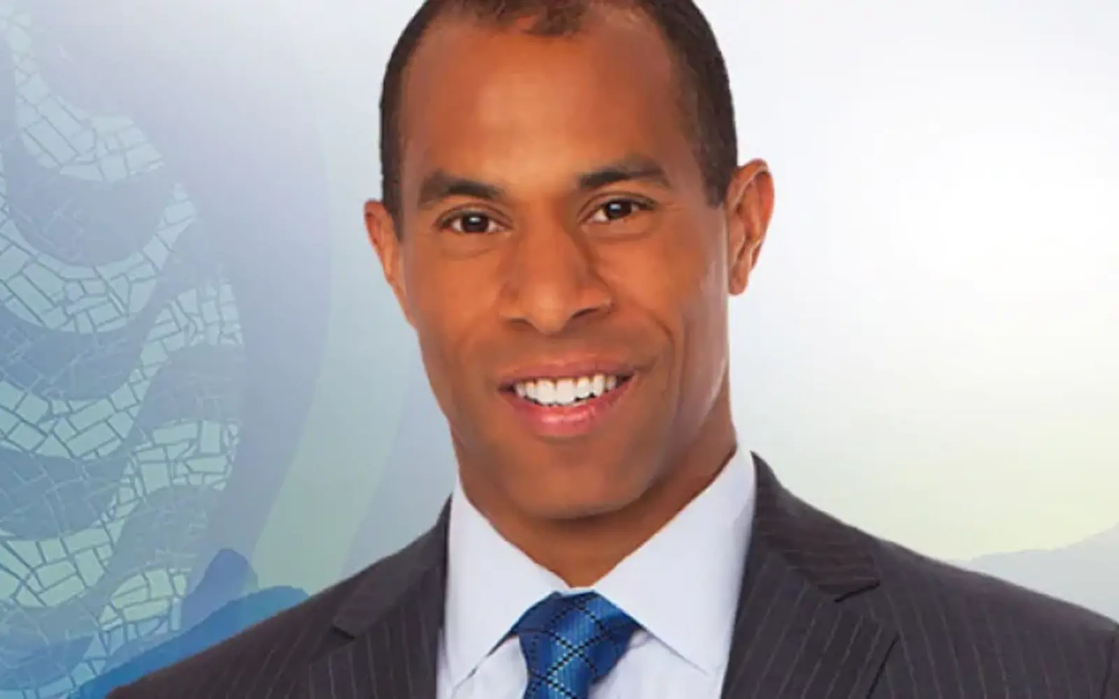 Headshot of a man in a suit.