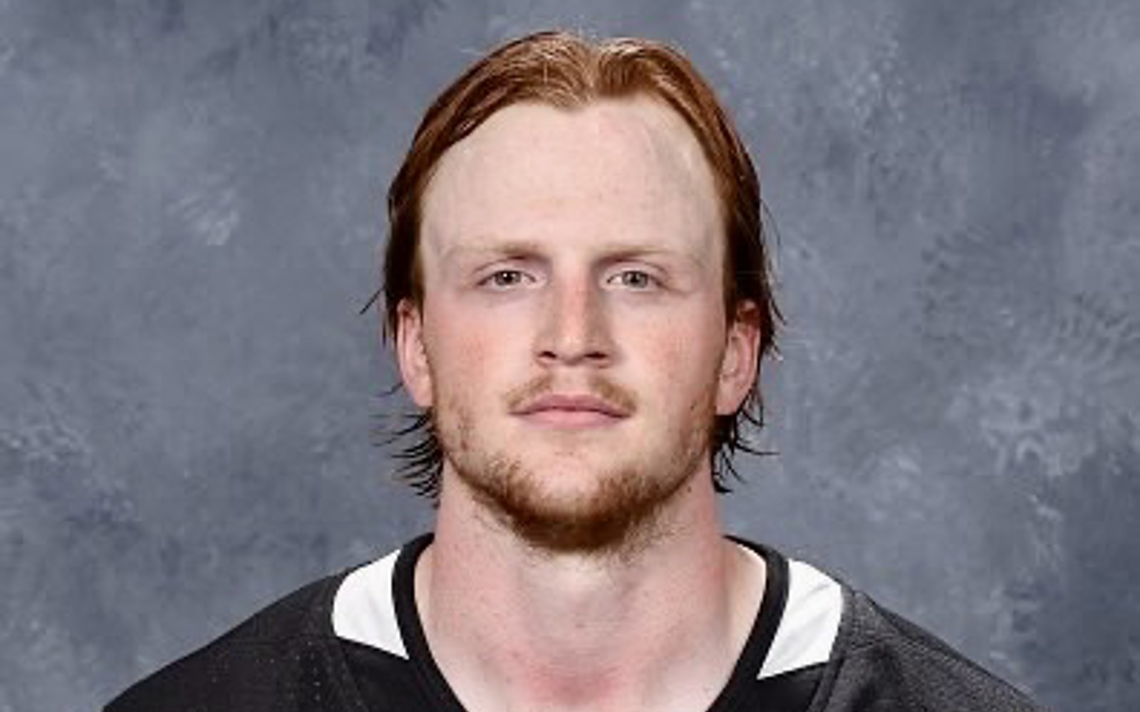 Man in a black LA Kings hockey jersey