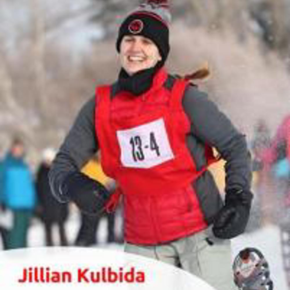 Closeup photo of Jillian Kulbida. It's also an action shot of her snowshoeing.