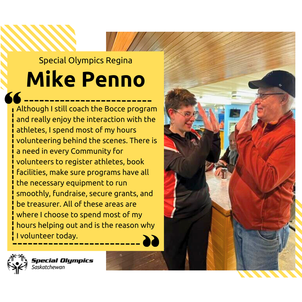 A photo of Mike Penno giving two high-fives to an athlete. Mike is seen in a red jacket to the right of the photo. The athlete is wearing her jersey and standing to the left of the photo. Both Mike and the athlete are facing each other to give the high fives.