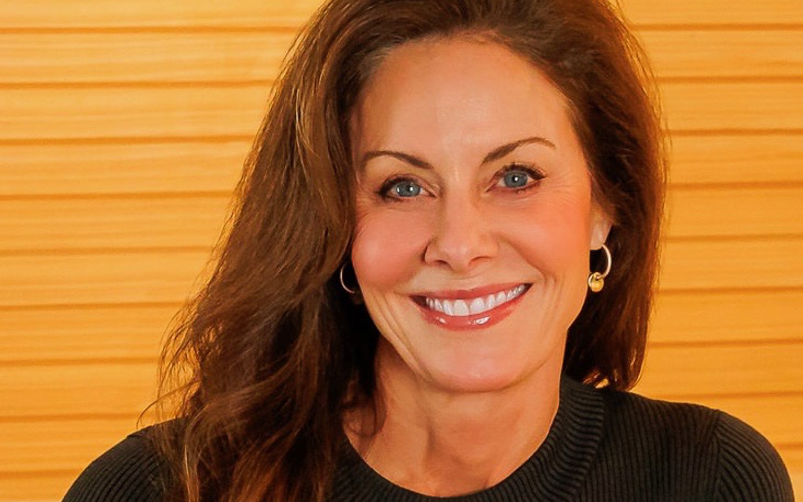 Headshot of a woman wearing all black