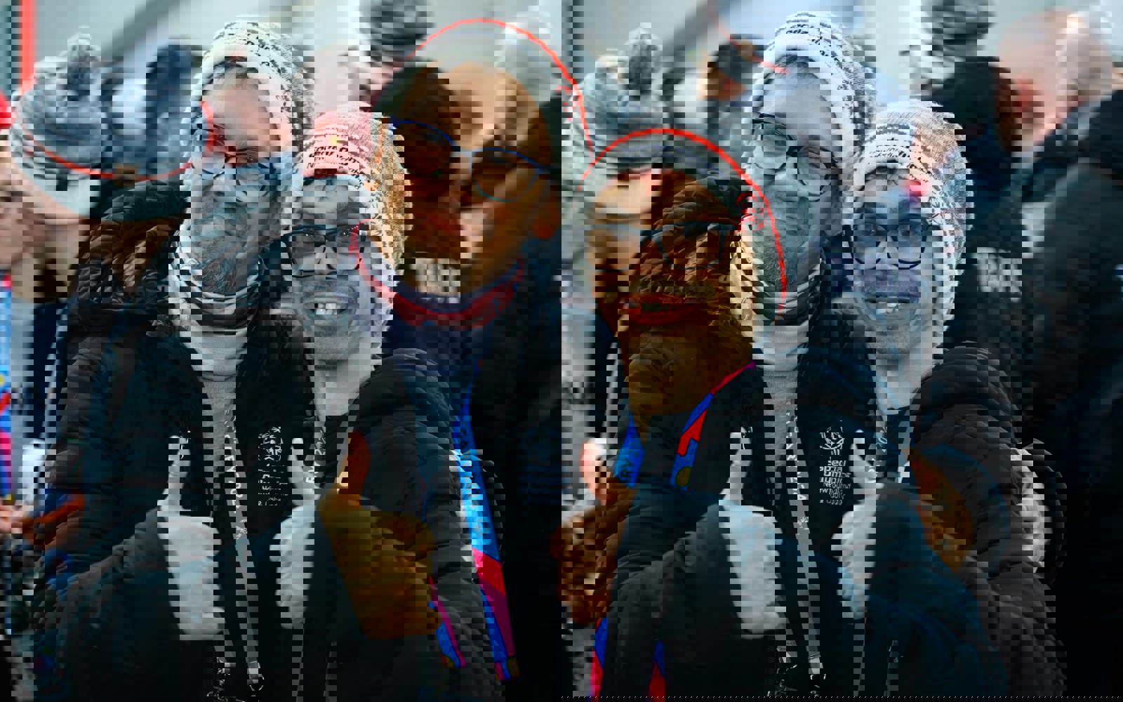 Two young men, both with glasses and a grey and white toque smiling at the camera and giving a thumbs up. 