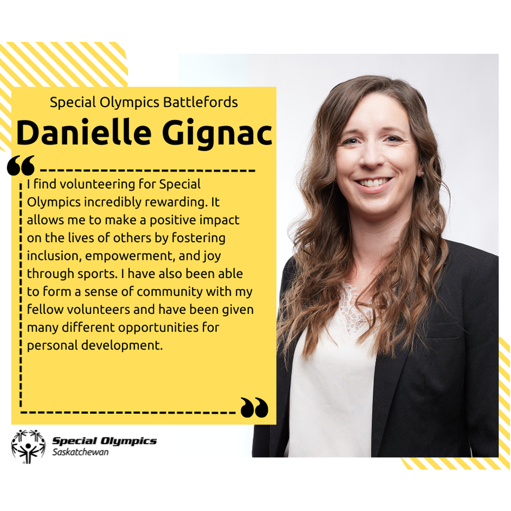 A professional headshot photo of Danielle. She is wearing a suit jacket and smiling for the camera.