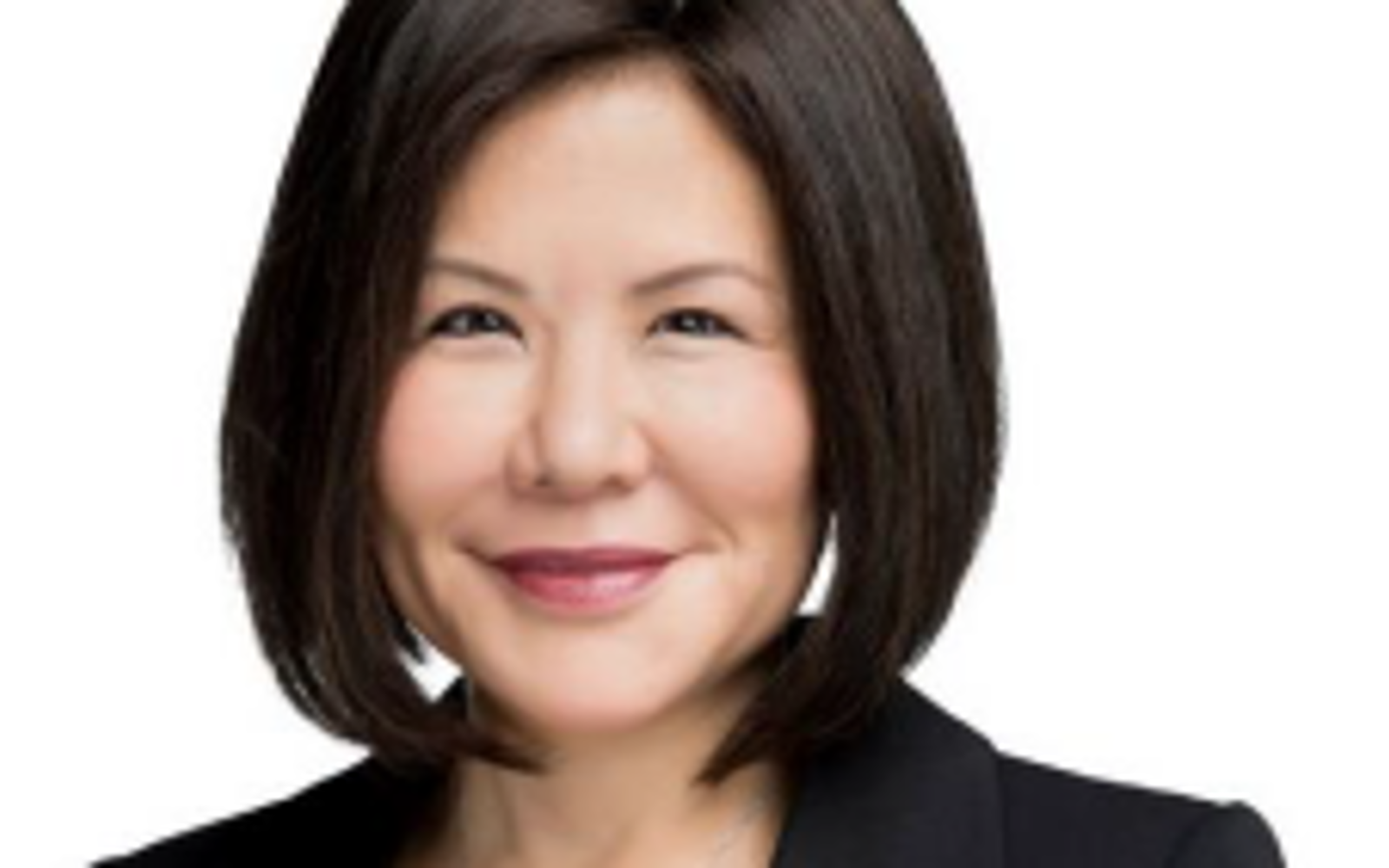 Woman with dark hair wearing a black blazer. 