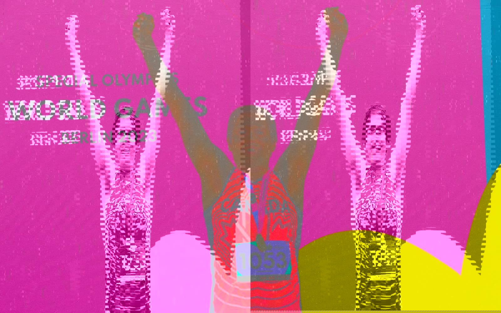 An athlete standing on the first place podium, with his arms raised above his head in celebration, and his gold medal hanging around his neck.